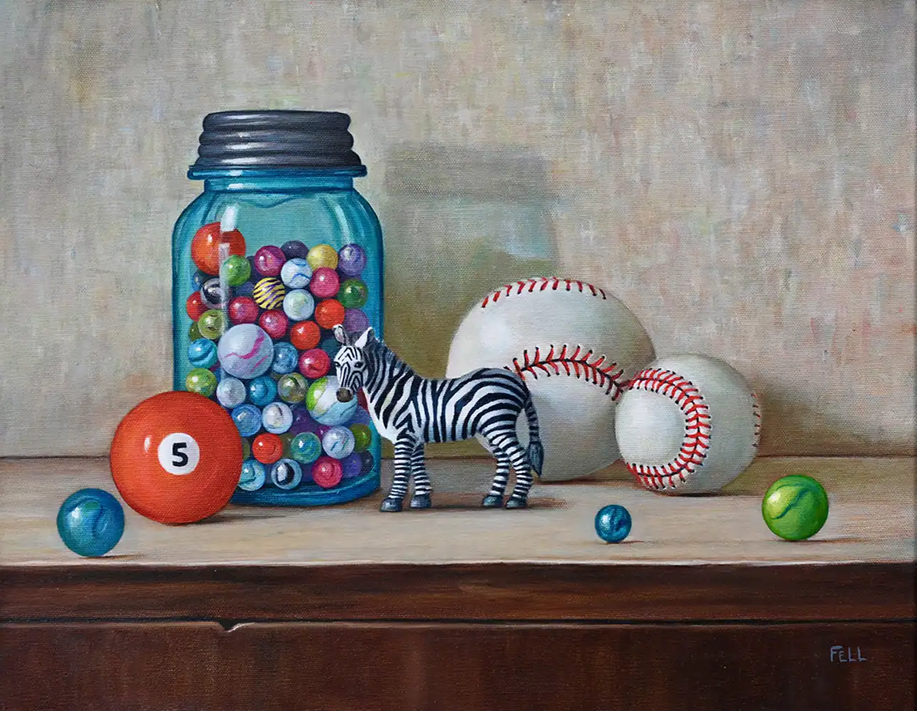 Colorful jar of marbles with a zebra figure and baseballs, part of the Threshold Exhibition art installation.